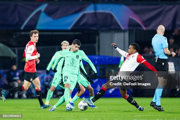 Alvaro Morata of Atletico Madrid and Quinten Timber of Feyenoord Rotterdam battle for the ball during the UEFA Champions League match between...