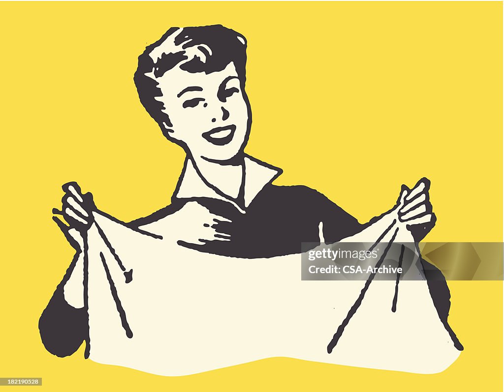 Smiling Woman Holding Sheet