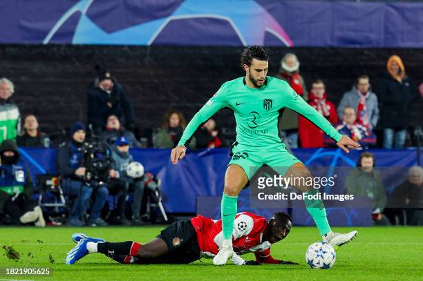Mario Hermoso of Atletico Madrid and Yankuba Minteh of Feyenoord Rotterdam battle for the ball during the UEFA Champions League match between...