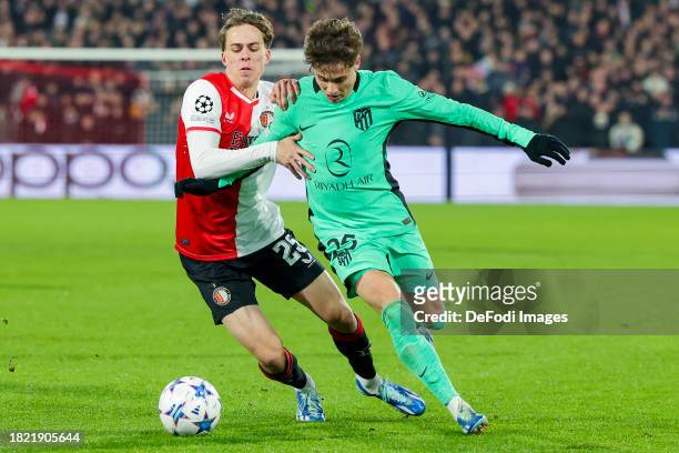 Leo Sauer of Feyenoord Rotterdam and Rodrigo Riquelme of Atletico Madrid battle for the ball during the UEFA Champions League match between Feyenoord...