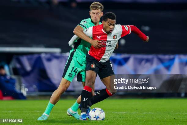 Marcos Llorente of Atletico Madrid and Quinten Timber of Feyenoord Rotterdam battle for the ball during the UEFA Champions League match between...