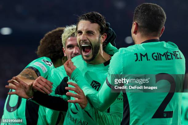 Mario Hermoso of Atletico Madrid celebrates after scoring his teams 0:2 goal with teammates during the UEFA Champions League match between Feyenoord...