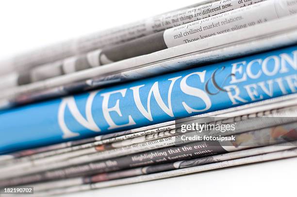 up close of economy newspapers - global news stock pictures, royalty-free photos & images