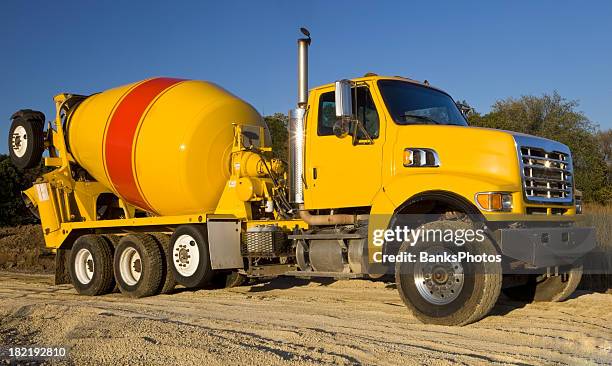 cement truck leaving a construction site - cement mixer truck stock pictures, royalty-free photos & images