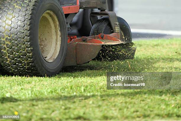 close-up of blade cutting grass - riding lawnmower stock pictures, royalty-free photos & images