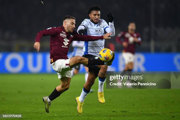 Nikola Vlasic of Torino FC is clashes with Dos Santos Ederson of Atalanta BC during the Serie A TIM match between Torino FC and Atalanta BC at Stadio...