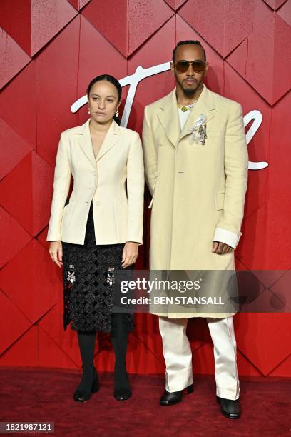 British pilot Lewis Hamilton and British fashion designer Grace Wales Bonner pose on the red carpet upon arrival at The 2023 Fashion Awards at the...