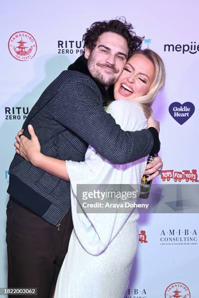 Grey Damon and Goldie Heart attend the Jordan Kuker and Katie Welch's 10th Annual Winter Wonderland Toys For Tots Charity Event at Yamashiro...