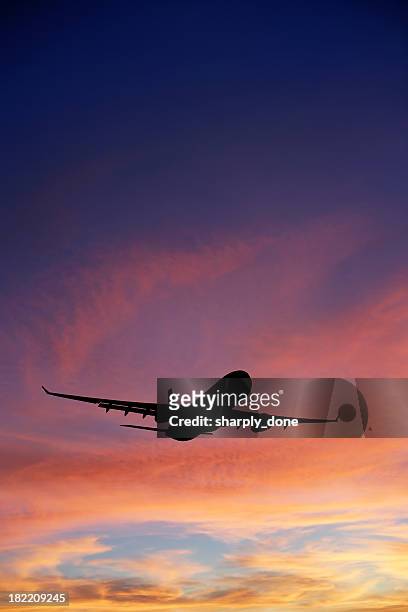 xxxl jet airplane taking off at sunset - flying stock pictures, royalty-free photos & images