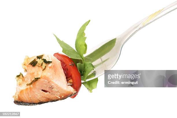 isolated background of salmon, rucola and tomato on fork - fork stock pictures, royalty-free photos & images