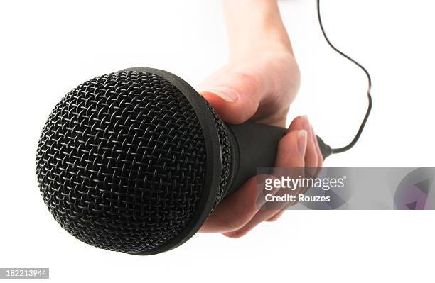 mikrofon in der hand - interview stock-fotos und bilder