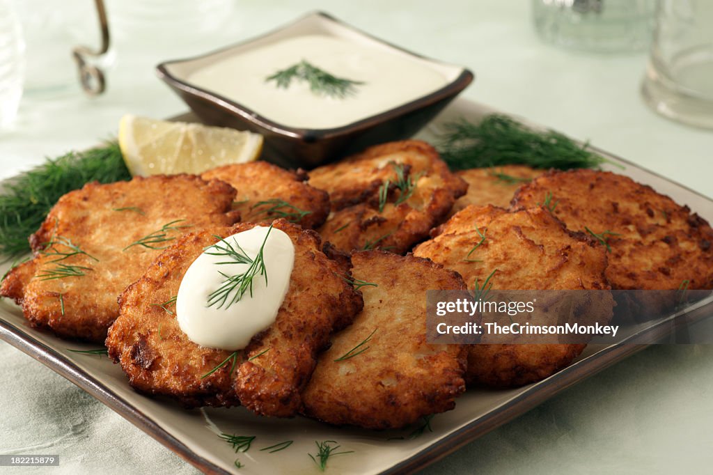 Latkes with garnishes and dressing