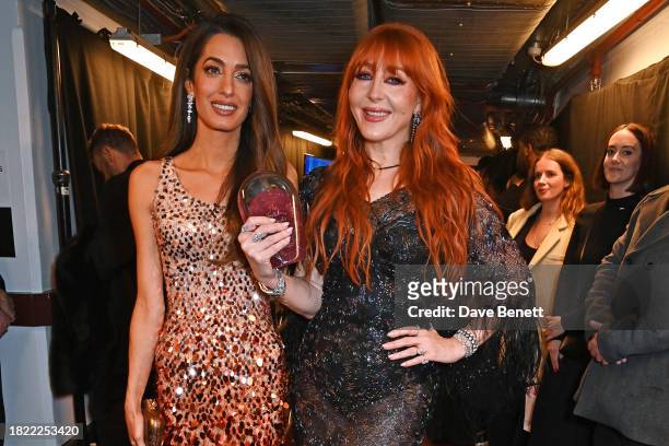 Amal Clooney and Charlotte Tilbury, winner of the Special Recognition Award, pose backstage at The Fashion Awards 2023 presented by Pandora at The...