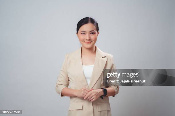 asian woman happy smiling looking at camera, isolated on white background. - super excited suit stock pictures, royalty-free photos & images