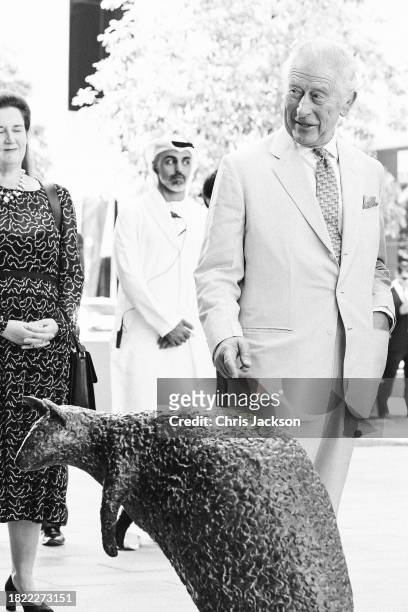 King Charles III reacts to a bronze sculptures of “Wollongong Wallabies” during a visit at the Heriot-Watt University to formally open the Dubai...