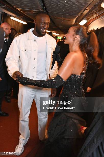 Stormzy and Maya Jama pose backstage at The Fashion Awards 2023 presented by Pandora at The Royal Albert Hall on December 4, 2023 in London, England.