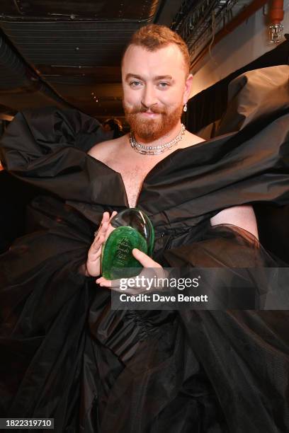 Sam Smith, winner of the Cultural Innovator Award, poses backstage at The Fashion Awards 2023 presented by Pandora at The Royal Albert Hall on...