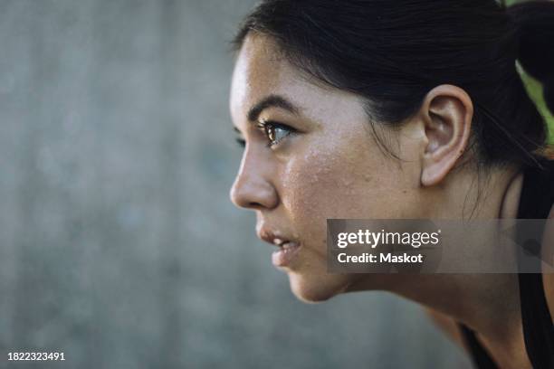 face of determined woman doing work out - determination stock pictures, royalty-free photos & images