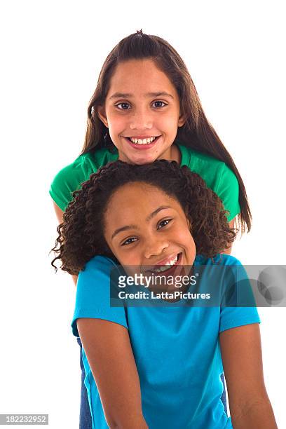 two teenage female friends in a row - two people white background stock pictures, royalty-free photos & images