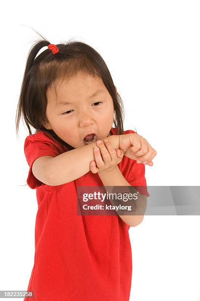 girl coughing into her arm - covering cough stock pictures, royalty-free photos & images