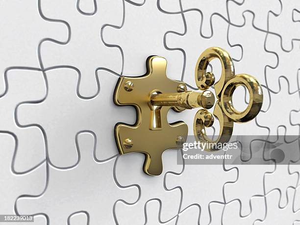 puzzle key - golden key stock-fotos und bilder