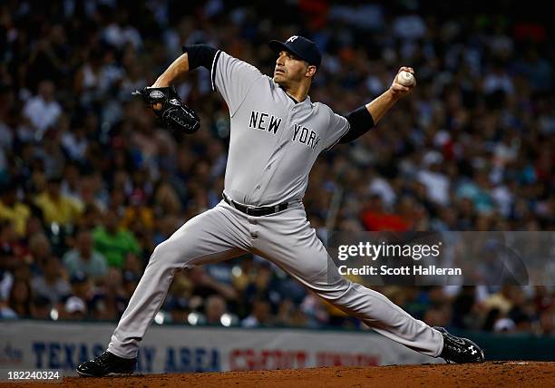 Andy Pettitte of the New York Yankees throws a pitch in the second inning against the Houston Astros at Minute Maid Park on September 28, 2013 in...