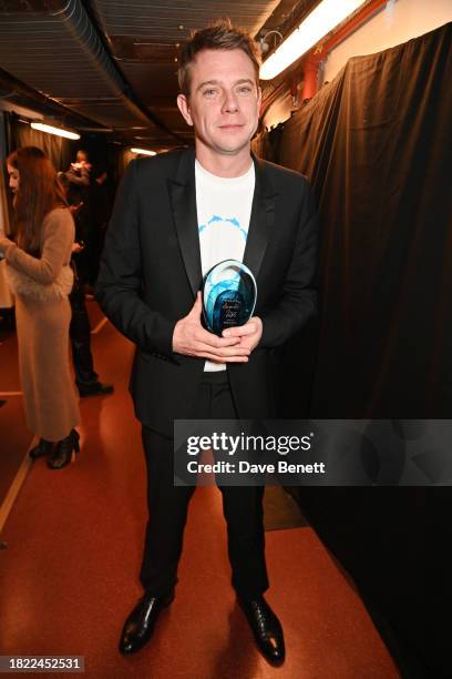 Jonathan 'JW' Anderson, winner of the Designer of the Year Award, poses backstage at The Fashion Awards 2023 presented by Pandora at The Royal Albert...