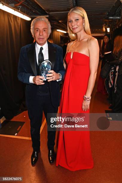 Giancarlo Giammetti, accepting the Outstanding Achievement Award on behalf of Valentino Garavani, and Gwyneth Paltrow pose backstage at The Fashion...