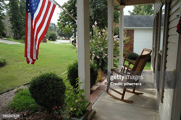 american front porch - rocking chair stockfoto's en -beelden