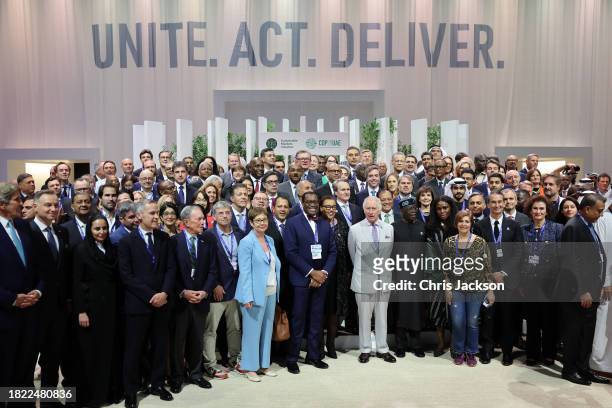 King Charles III poses with attendees at the Business and Philanthropy Climate Forum reception during COP28 on November 30, 2023 in Dubai, United...