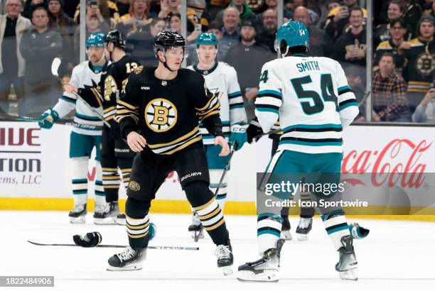 Boston Bruins center Trent Frederic stares down San Jose Sharks left wing Givani Smith during a game between the Boston Bruins and the San Jose...