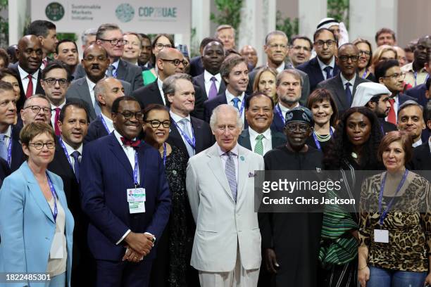 King Charles III poses with attendees at the Business and Philanthropy Climate Forum reception during COP28 on November 30, 2023 in Dubai, United...