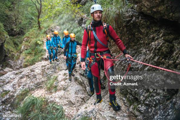 diverse friends and caucasian guide canyoning adventure - slovenia spring stock pictures, royalty-free photos & images