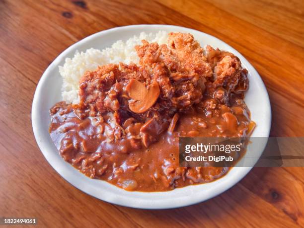 demi-glace sauce chicken cutlet with hashed beef over rice - yōshoku stock pictures, royalty-free photos & images