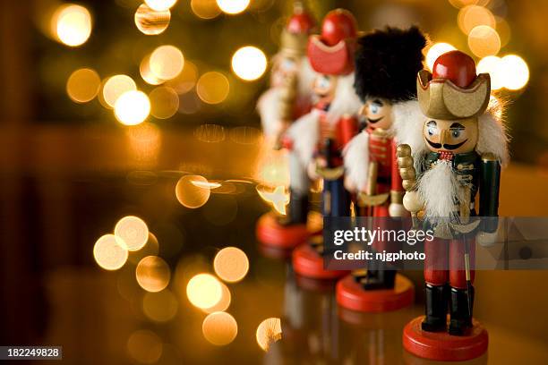 christmas nutcracker soldiers on a mantle - nutcrackers stock pictures, royalty-free photos & images