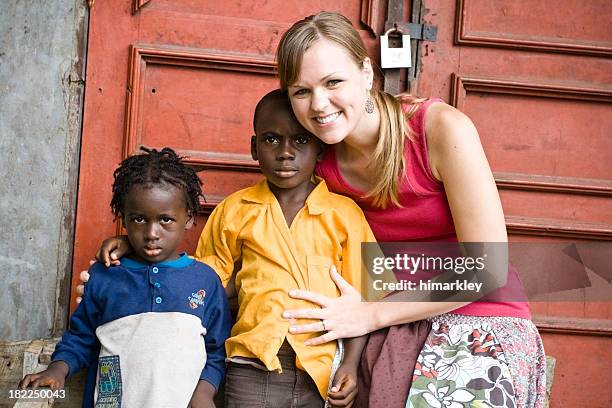 american woman with african children - missionary stock pictures, royalty-free photos & images