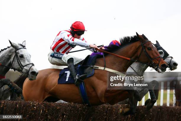 Gavin Sheehan riding Passing Well jumps the last fence on his way to winning The Watch Races On The Racing App Novices' Handicap Steeple Chase at...