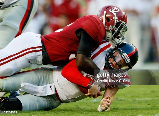 Mosley of the Alabama Crimson Tide tackles Bo Wallace of the Mississippi Rebels at Bryant-Denny Stadium on September 28, 2013 in Tuscaloosa, Alabama.