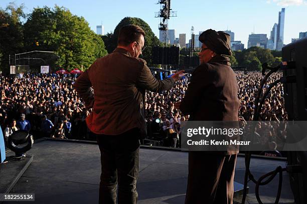 Bono and the President of Liberia Ellen Johnson Sirleaf appear at the 2013 Global Citizen Festival in Central Park to end extreme poverty on...