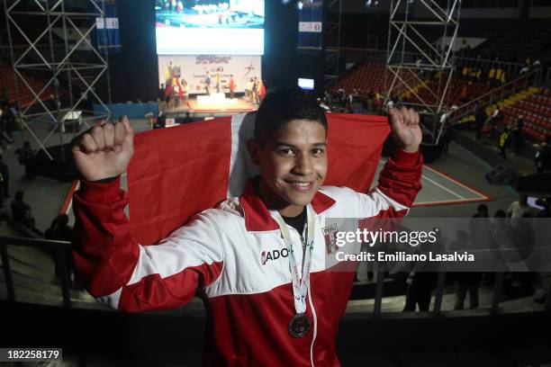 Oscar Torres of Peru, silver medalist in Men's 69 kg, poses por a picture as part of the I ODESUR South American Youth Games at Coliseo Miguel Grau...