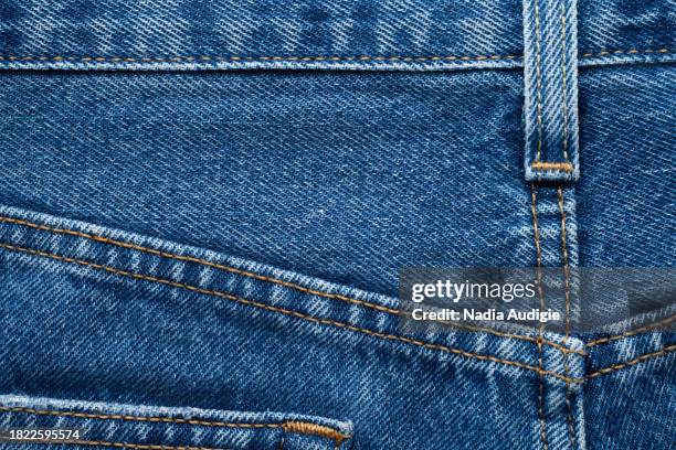 blue jean back background - yellow belt stock pictures, royalty-free photos & images