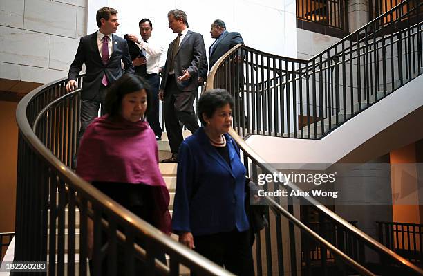 House Democratic members arrive for a House Democratic Caucus meeting September 28, 2013 on Capitol Hill in Washington, DC. The House will vote later...