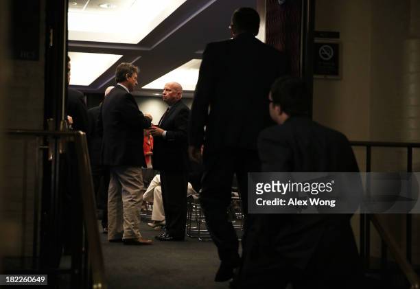 Republican House members, including Rep.Kevin Brady and Rep. Lynn Westmoreland , remain in the meeting room after a House Republican Conference...