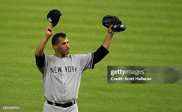 Andy Pettitte of the New York Yankees celebrates after pitching his last game and defeating the Houston Astros 2-1 at Minute Maid Park on September...