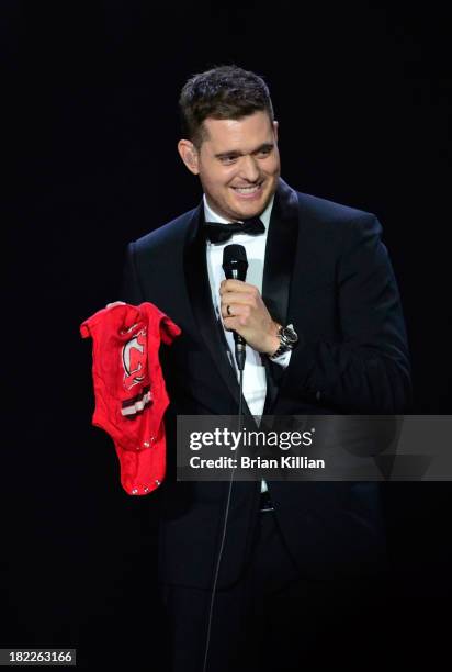 Singer Michael Buble performs at Prudential Center on September 28, 2013 in Newark, New Jersey.