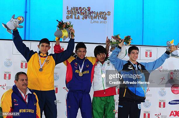 Sanchez of Colombia, A. Montero of Venezuela, E. Yapuri of Bolivia and A. Destribats of Argentina pose with his medals in Greco Roman 63kg as part of...