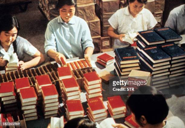 Employees of the Government Printing House pack in 1971 in Bejing copies of Mao Zedong's "Little Red Book," the bible of the Maoism, teaching the...