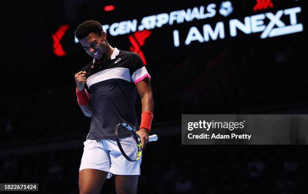 Arthur Fils of France celebrates winning a point over Dominic Stricker of Switzerland in the third round robin match during day three of the Next Gen...