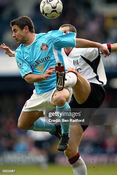 Kevin Phillips of Sunderland is challenged by Andy Melville of Fulham during the FA Barclaycard Premiership match between Fulham and Sunderland at...