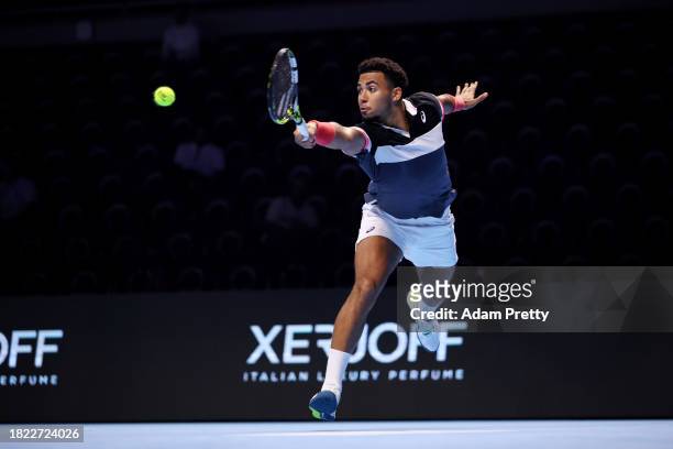 Arthur Fils of France plays a backhand to Dominic Stricker of Switzerland in the third round robin match during day three of the Next Gen ATP Finals...